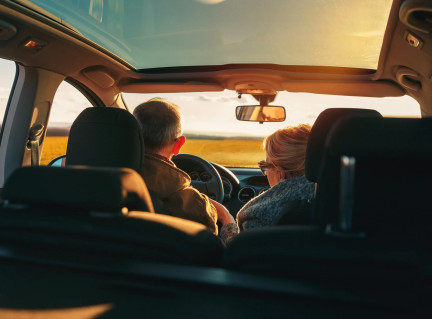 elderly driver and passenger in the car